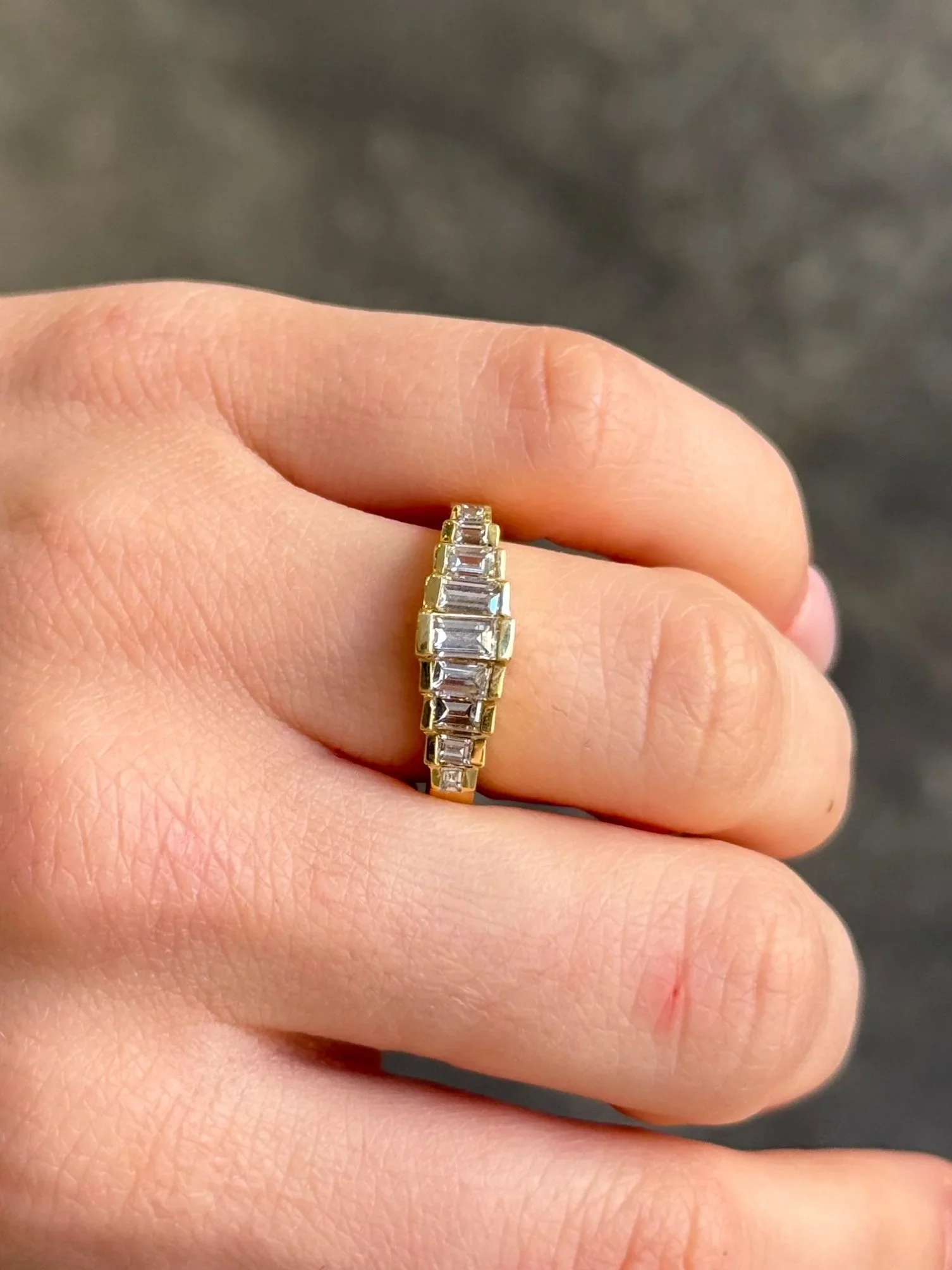 Ladies Channel Set Emerald Graduated Diamond Band