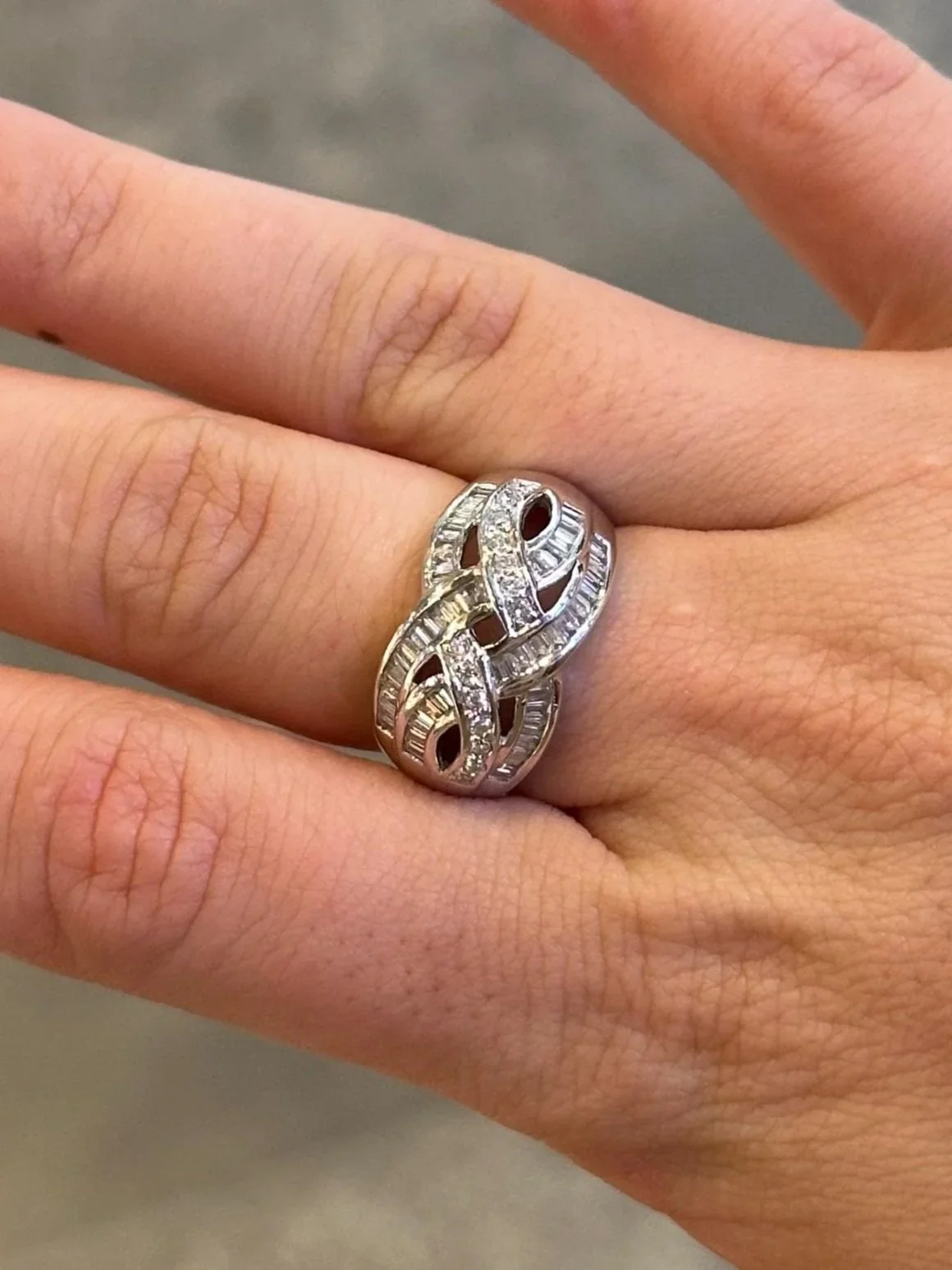 Ladies Intertwining Baguette and Round Diamond Ring